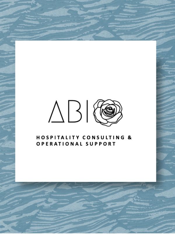 Logo for AB hospitality consulting with a rose symbol on a textured blue background.