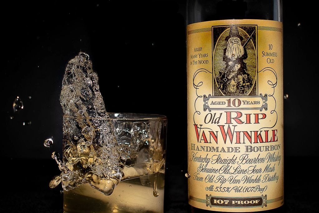 Splash of whiskey, next to bottle 