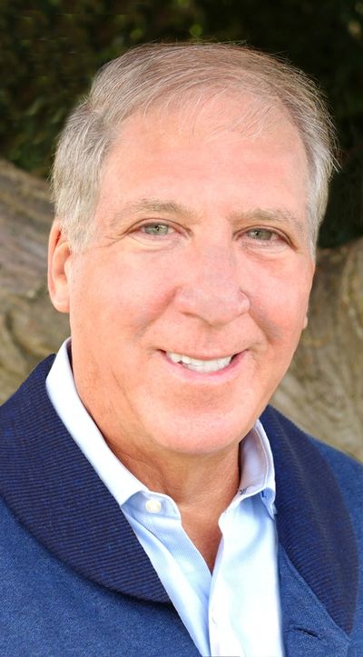 Smiling middle-aged man outdoors.