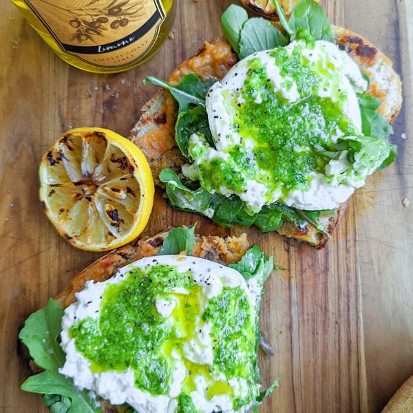 burrata and arugula on toast with pesto sauce