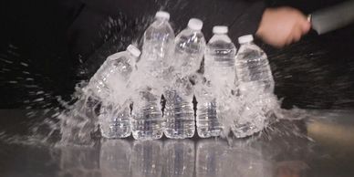 High impact Direct Response Infomercial Demo - Water Bottles being sliced by knife 