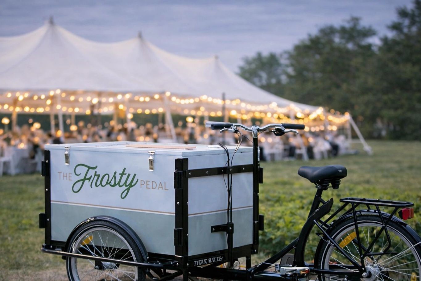 Vintage style ice cream bike at an outdoor tent wedding
