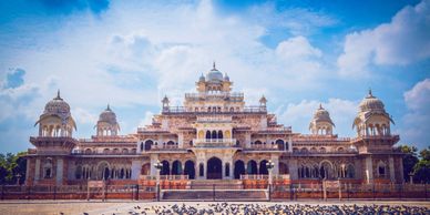 Albert Hall Museum in Jaipur Rajasthan with pigeons feeding in the foreground