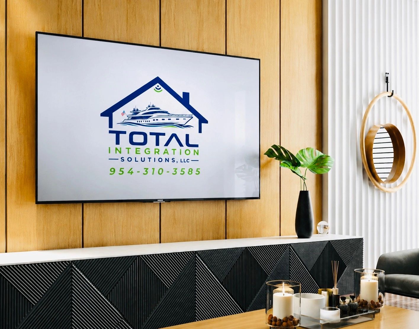 Modern living room with a wall-mounted TV displaying Total Integration Solutions logo.