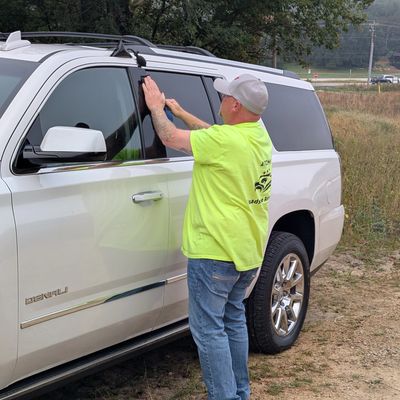 Roadside assistance man doing a lockout service