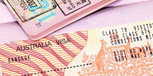 Close-up of an Australian visa with detailed patterns and stamps.
