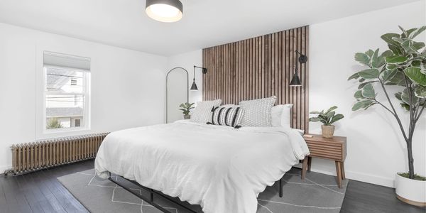 This modern bedroom features a spacious layout with clean lines and minimalist decor.