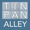 Logo with text 'TIN PAN ALLEY' in blue and white.