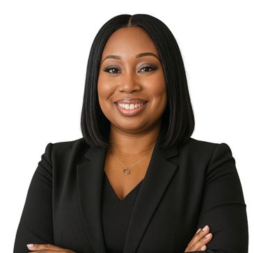 Confident woman in black blazer smiling.