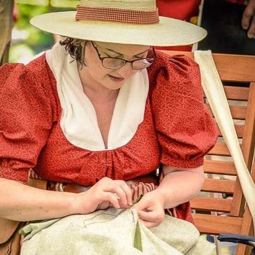 I demonstrate hand sewing as a historical re-enactor when talking to visitors.