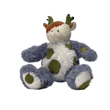 A plush stuffed animal resembling a patchy cow with textured, fluffy fabric.