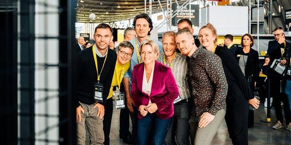 Group of people smiling and posing