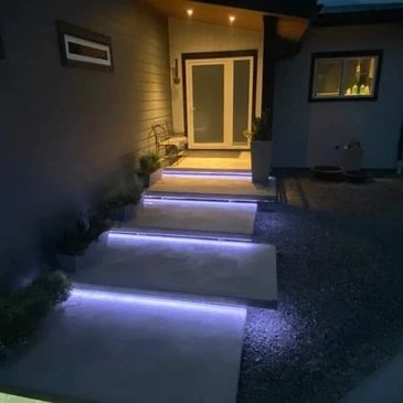 completed concrete floating steps with LED under mounted lighting. 