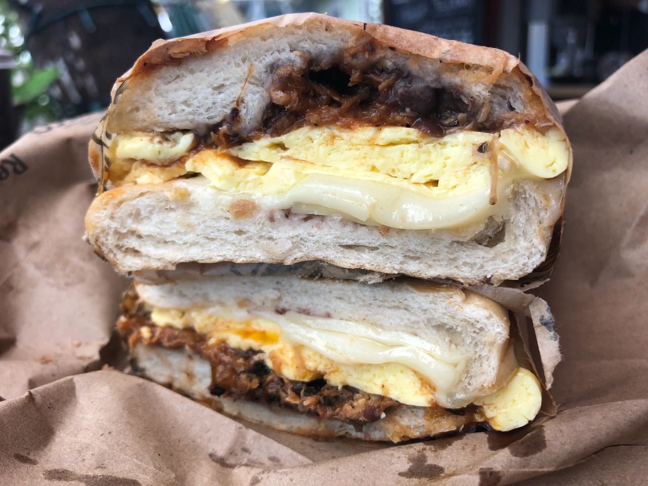 The amazing El Cubano breakfast sandwich at The Fisherman's Cafe in Key West is packed with eggs, melty Swiss cheese and three (3!) kinds of pork. 