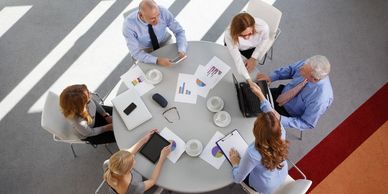 Businesspeople around a table.