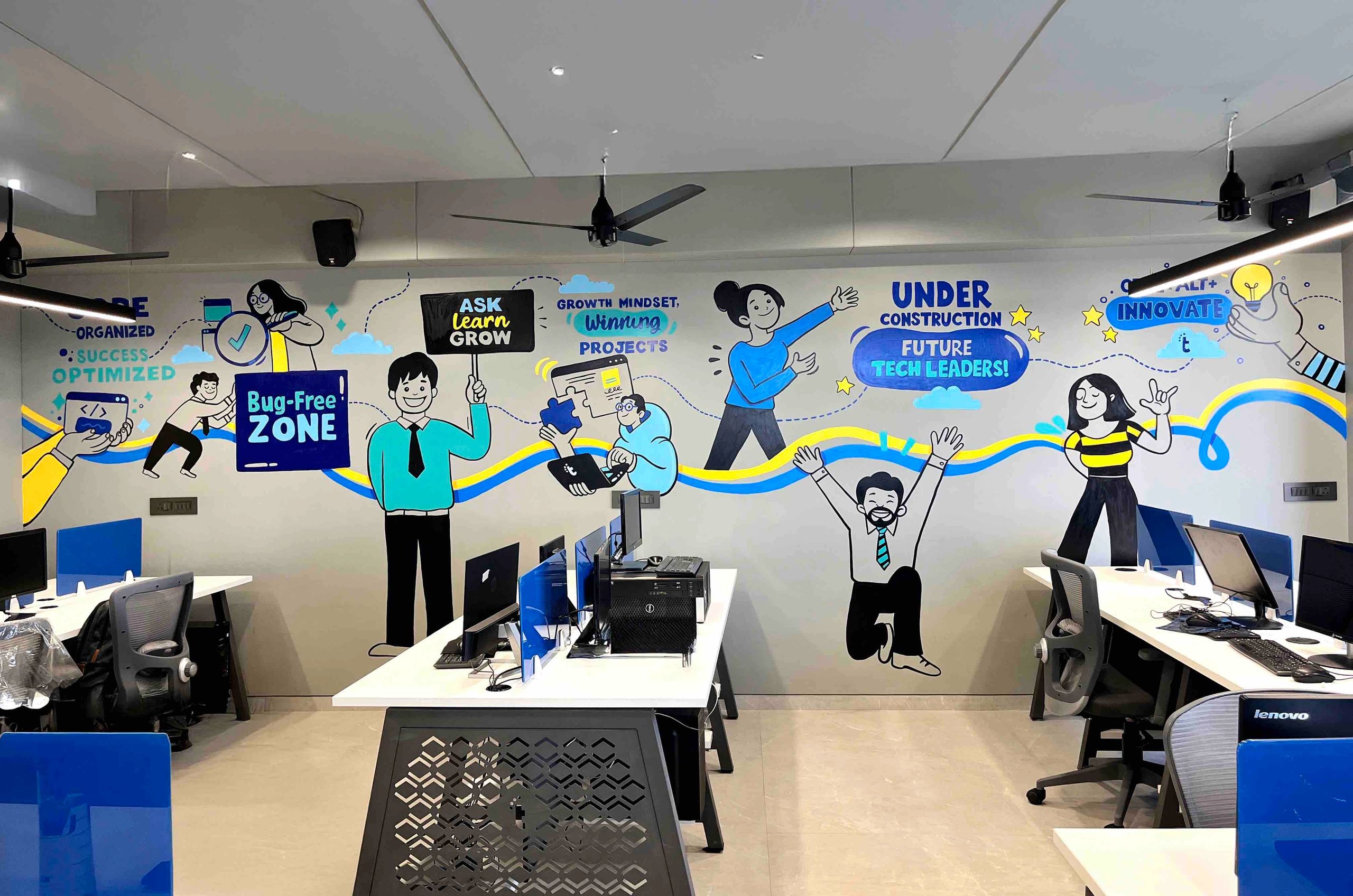 Colorful tech-themed mural in an office workspace.