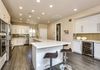 We increased the depth of the bar area by stealing 9" from the master bath to accommodate standard depth cabinets and a wine refrigerator