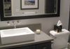 Quick guest bathroom makeover with new vessel sink, engineered quartz counter top, faucet, tile floor and refinish of existing vanity