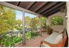 Indoor/outdoor living from the master bedroom balcony overlooking front courtyard