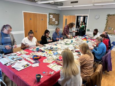 Group crafting session in a community room.