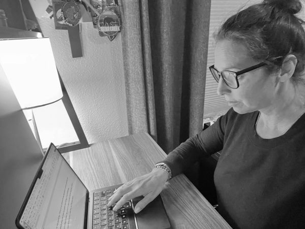 Antonia at her desk working on a personal essay or her memoir