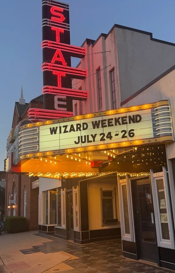Theater marquee advertising Wizard Weekend in July.