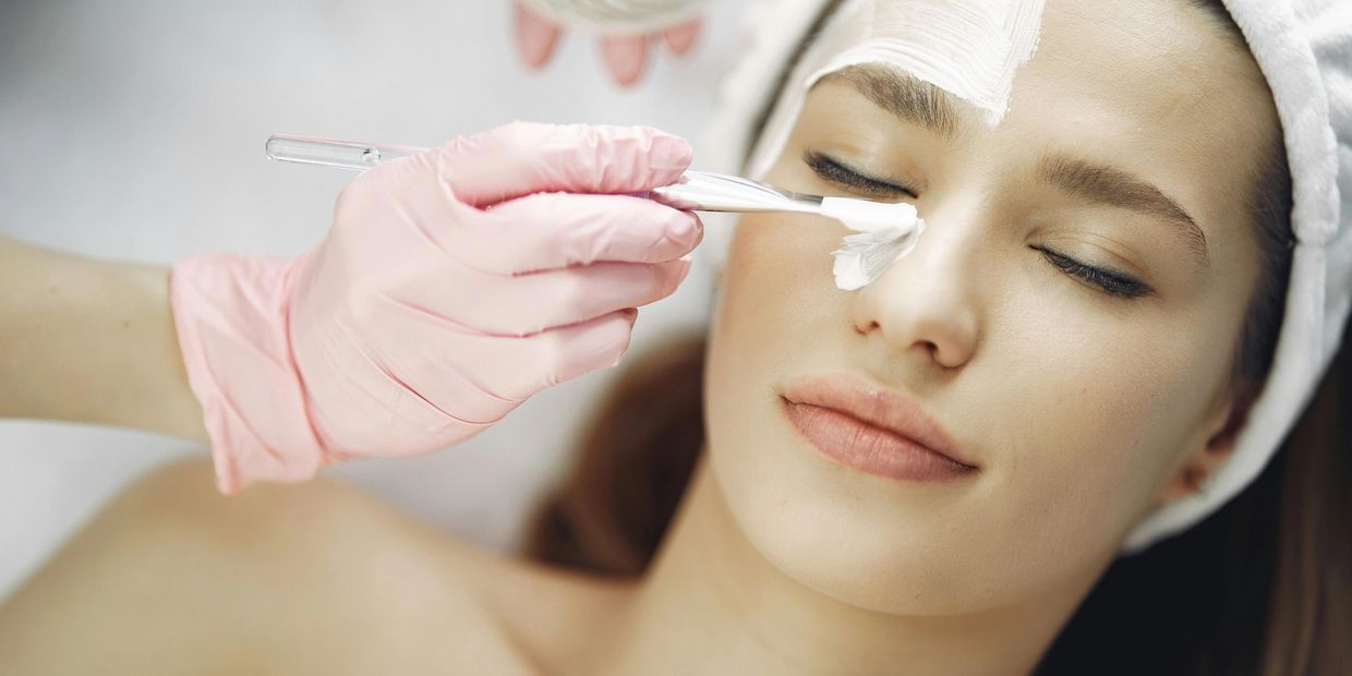 Woman receiving Chemical Peel treatment in Dr. Singh's Cosmedica Department, Bangalore  Skin Clinic