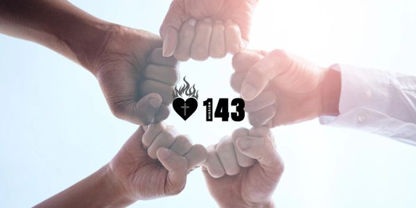 Four hands forming a fist circle with a heart and number 143 symbol in the center.
