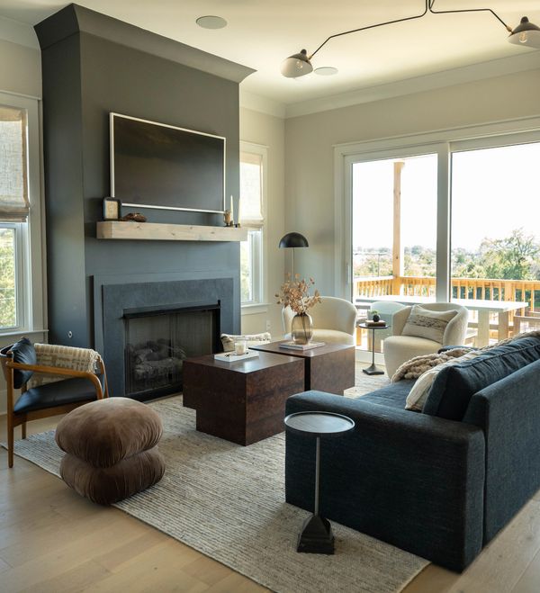 family room with black fireplace and neutral color palette