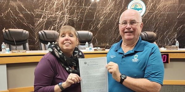 Kelly accepts a proclamation from City of New Port Richey Mayor Rob Marlow, January 2022 