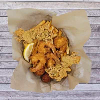 Crispy fried oysters and jumbo shrimp served with seasoned fries and hush puppies. Fresh seafood, bo