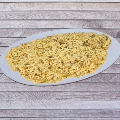 Plate of Dirty Rice on a p wooden surface.