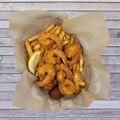 Enjoy our Jumbo Shrimp Basket featuring crispy fried jumbo shrimp, seasoned fries, and hush puppies—