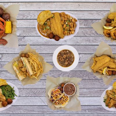 Seafood feast with diverse Cajun Food dishes and sides.