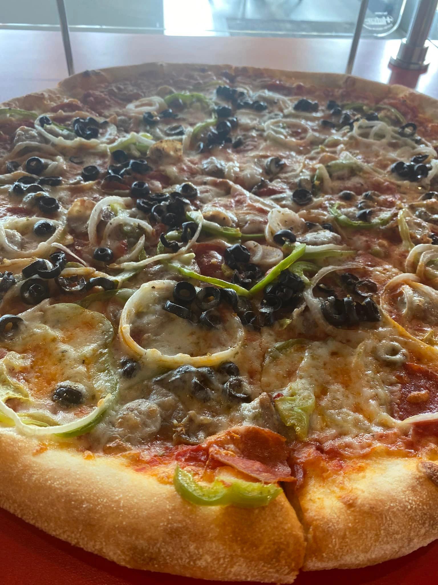 Delicious Slice Pizza at Mulberry St NY Pizzeria