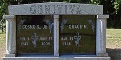A two-crypt gray granite mausoleum with black granite doors. 