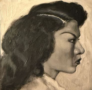 Monochromatic side profile portrait of a woman with textured hair.