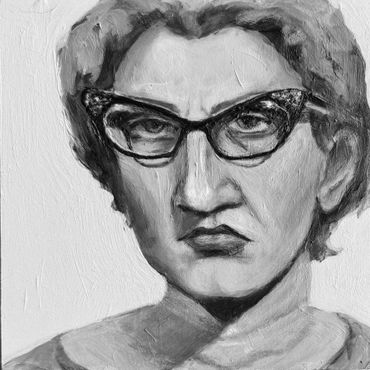Black and white portrait of a woman with glasses and a stern expression.