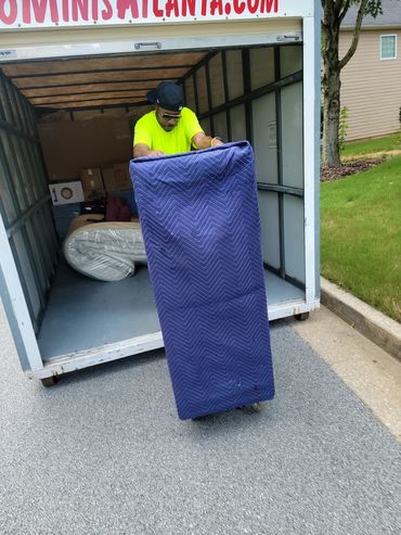 Mover loading dresser into storage pod in Mableton, GA. 