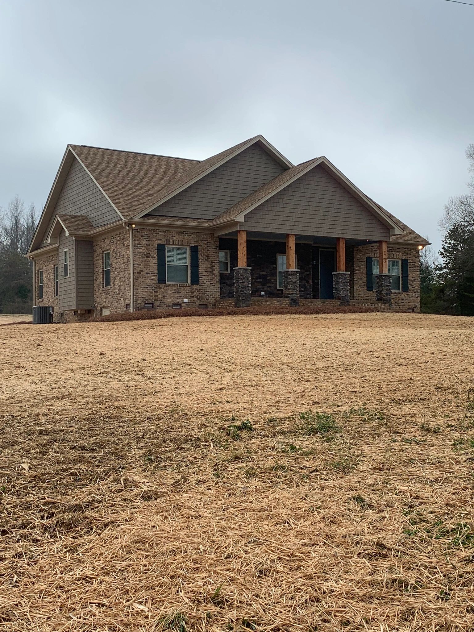 Beautiful custom built home with inviting front porch. Lovely cedar and stone columns!