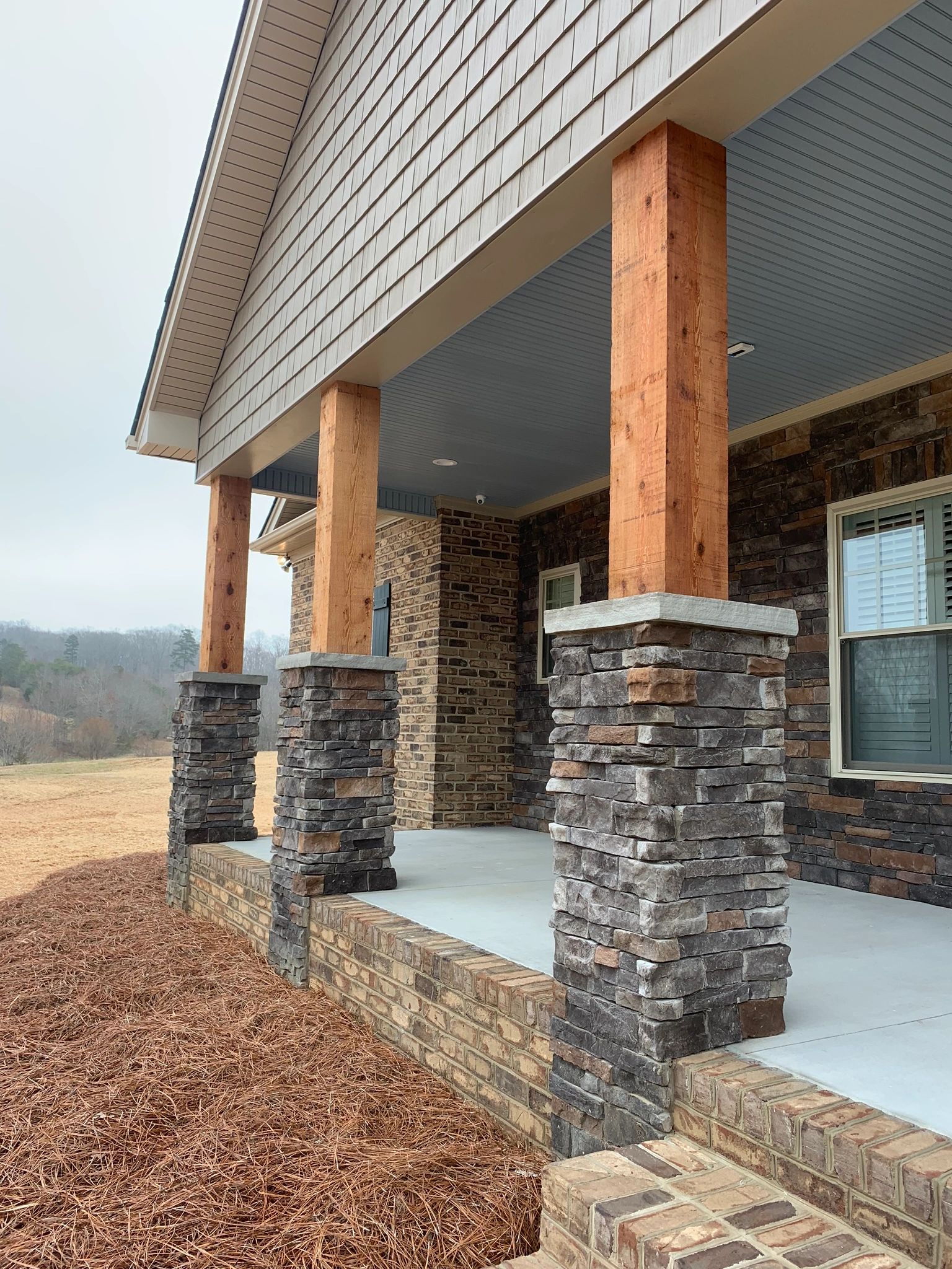 Cedar posts and rock columns are very popular trend on front porches right now. Timeless beauty!