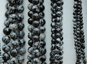 Snowflake Obsidian Beads.  Round Beads, Shaped beans - Coins, ovals, square.
Golden Obsidian.