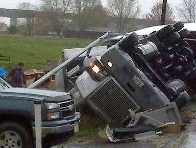 Truck wrecks, truck on its side