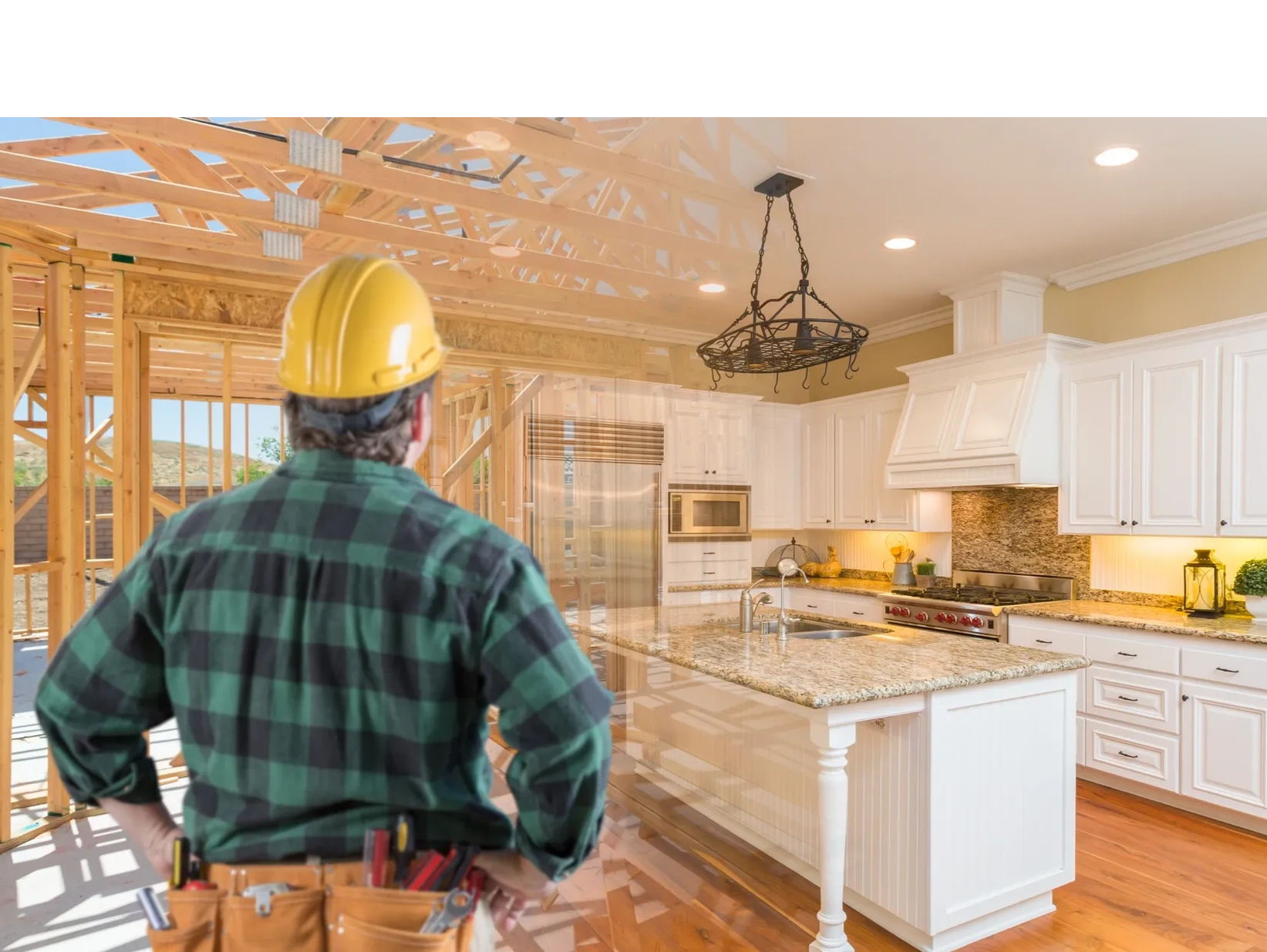 Construction worker envisions a finished kitchen inside a wooden house frame.