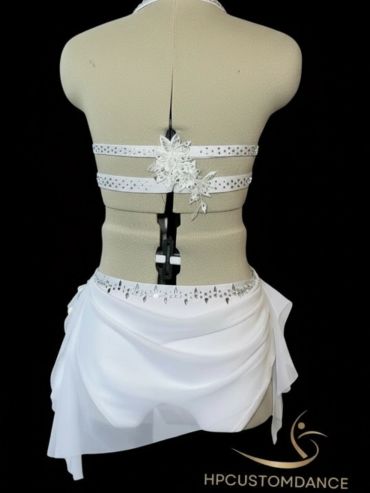 Back view of a white dance costume on a mannequin.