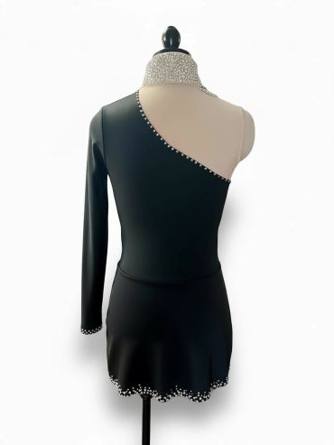 Black one-sleeve dress with pearl embellishments.