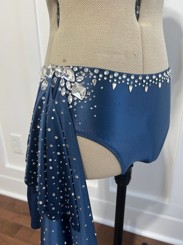 Blue skirt with rhinestone embellishments on mannequin.
