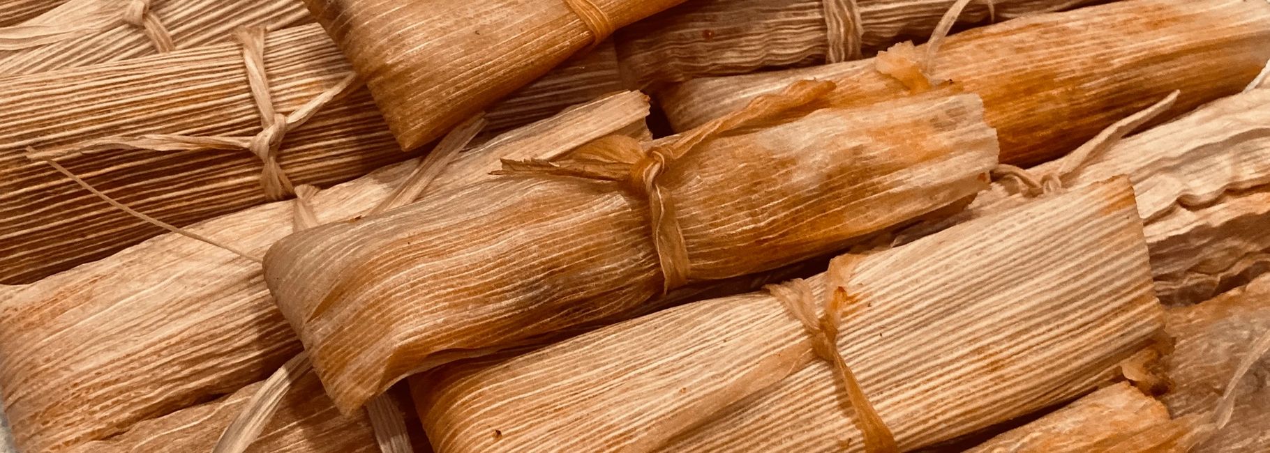 Traditional tamales with decorated corn husk