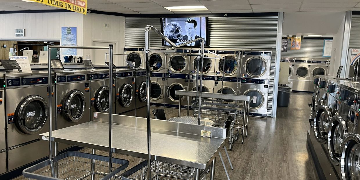 Industrial size dryers and washing machines.