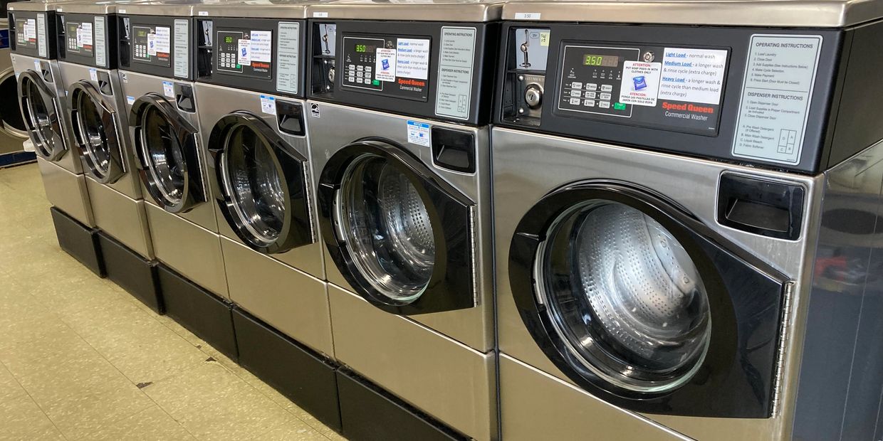 A row of industrial washing machines in Plymouth.